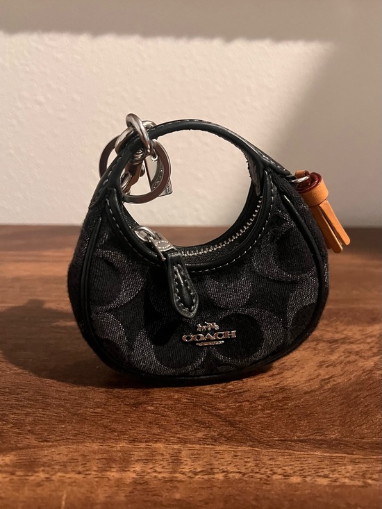 Coach Handbags - Coach Black Mini Signature Circle Bag Charm with Tan Tassel